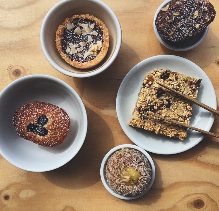 Brownie, flapjack and tart slices in white bowls
