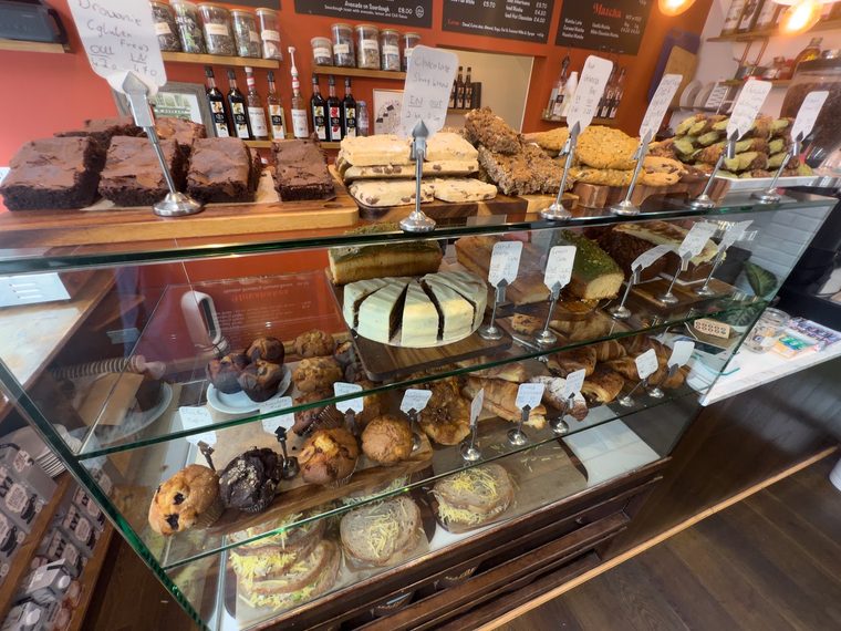 Cakes, cookies and tarts in the glass cabinet