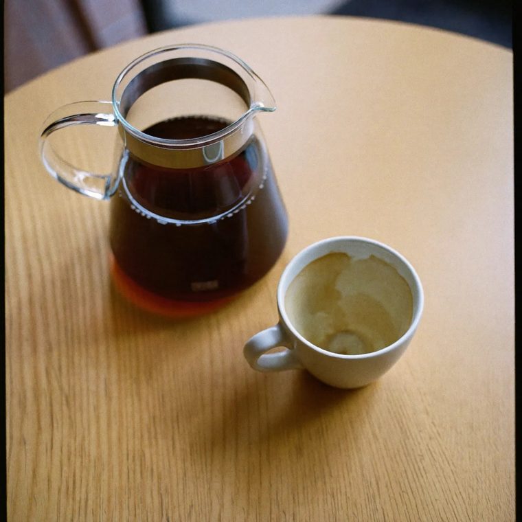 Filter coffee served in a glass carafe with a cup